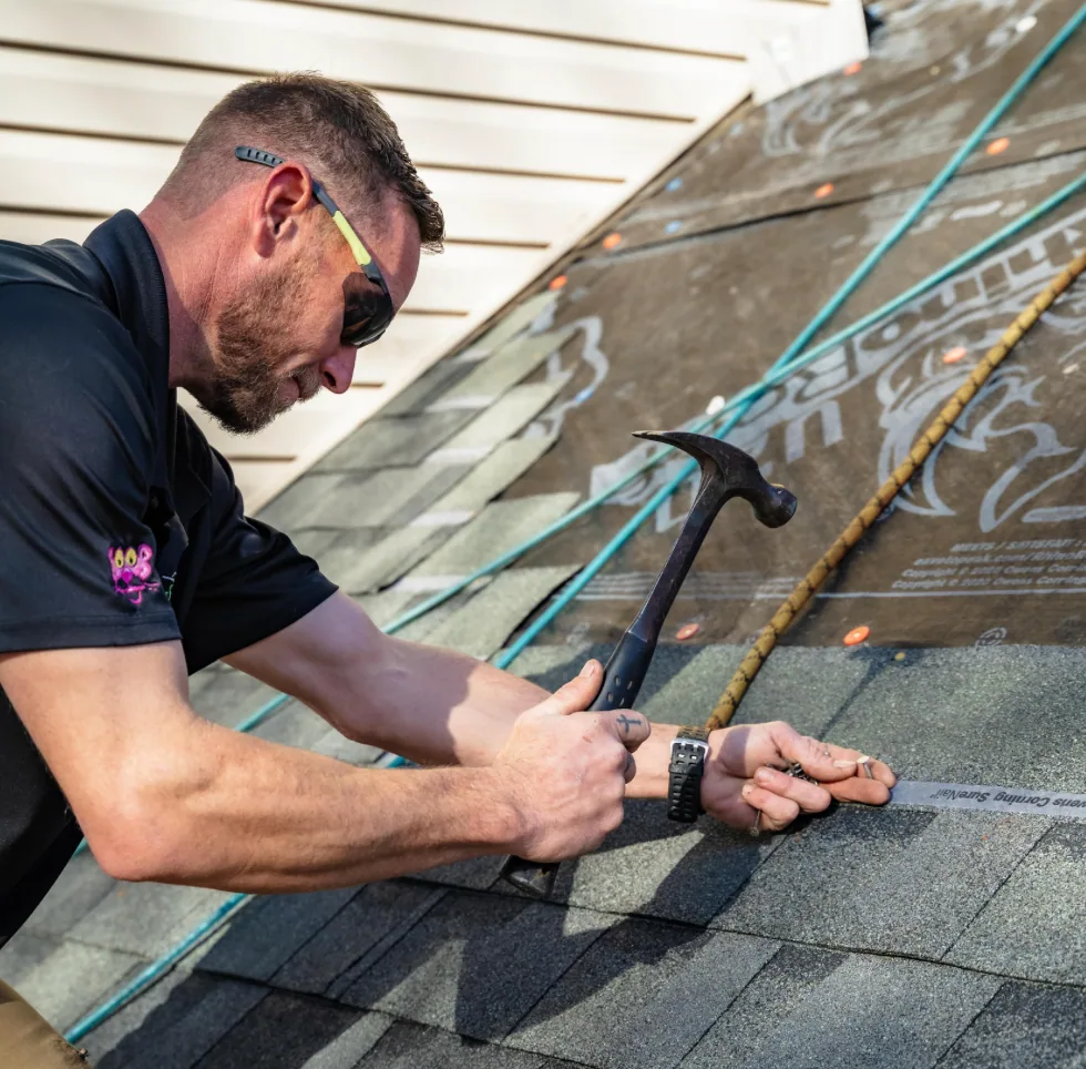 Roofing crew setting up job site